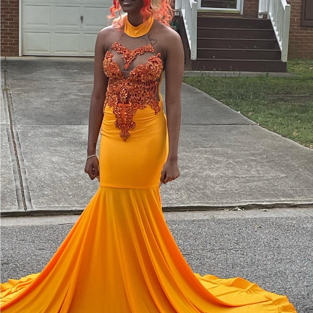 Elegant Orange Gown with Intricate Lace Detail